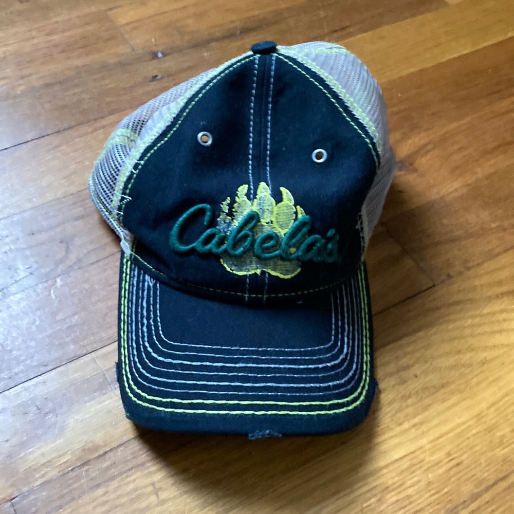 (Suppsed to be worn looking for looks) Cabelas hat.